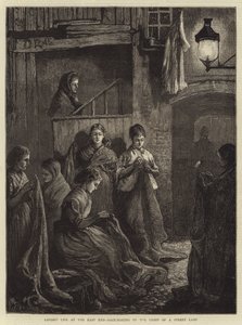 Londen Leven in het Oostelijke Eind, Zak Maken bij het Licht van een Straatlamp door William Bazett Murray